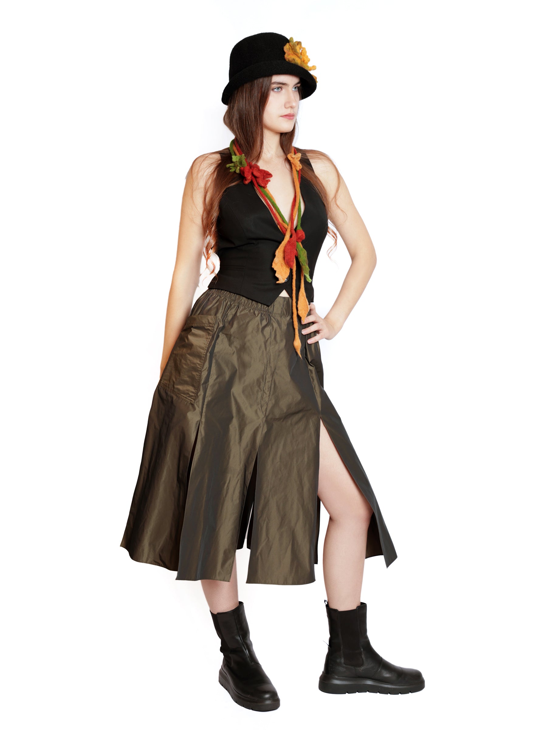 Full-length view of a model wearing a multicolor handmade wool neckpiece as a statement accessory.