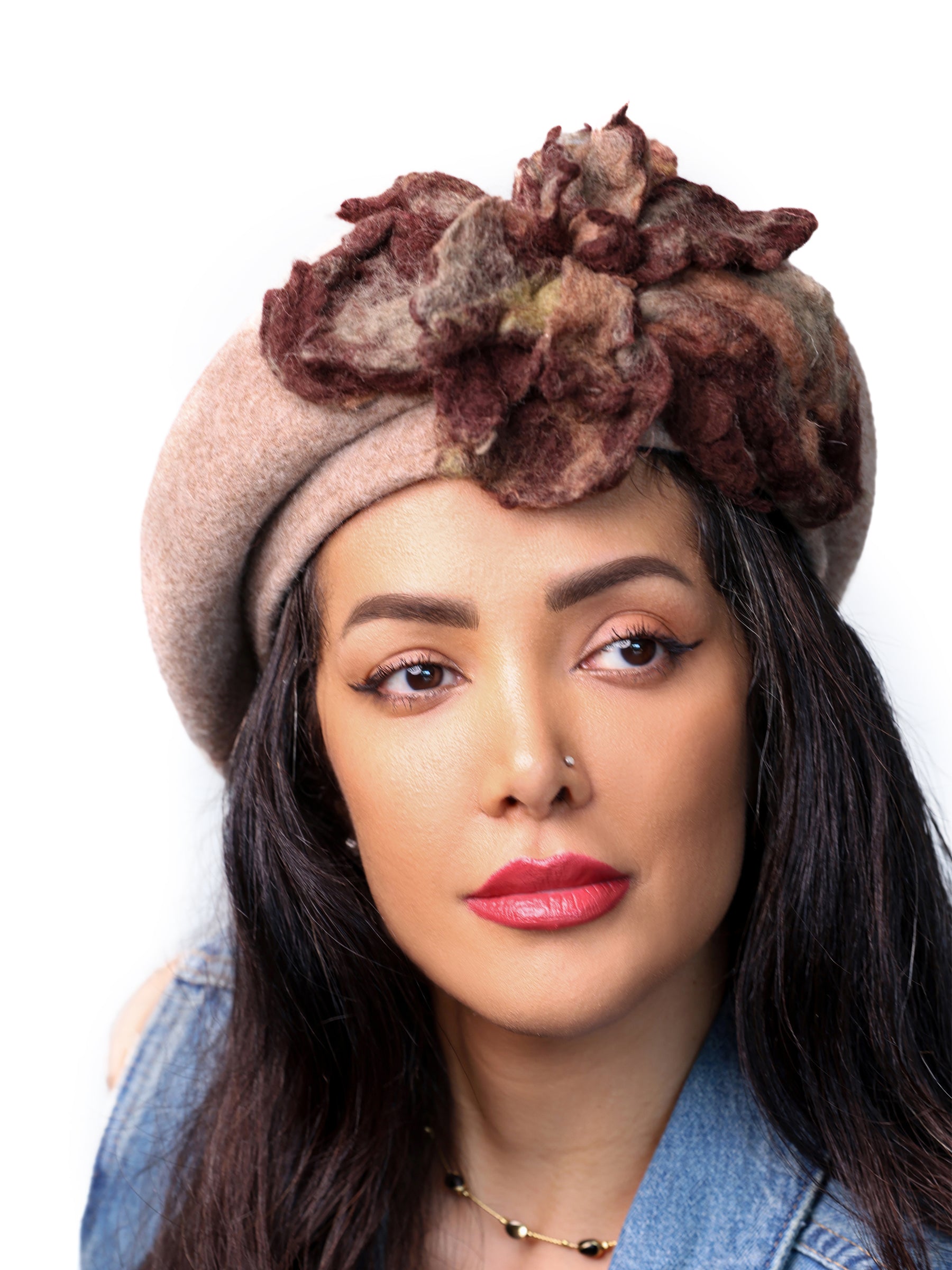 Front view of a khaki-beige wool winter beret hat with layered handmade felt floral embellishment.