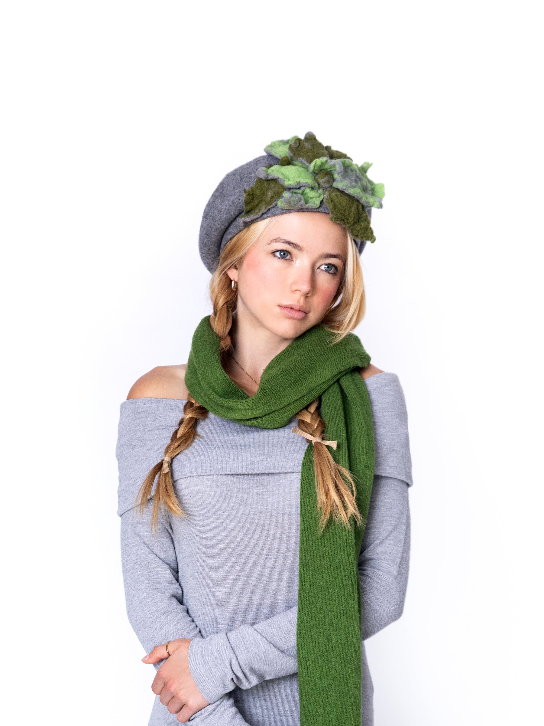 Full-length view of a model wearing a grey wool beret hat as a statement accessory.
