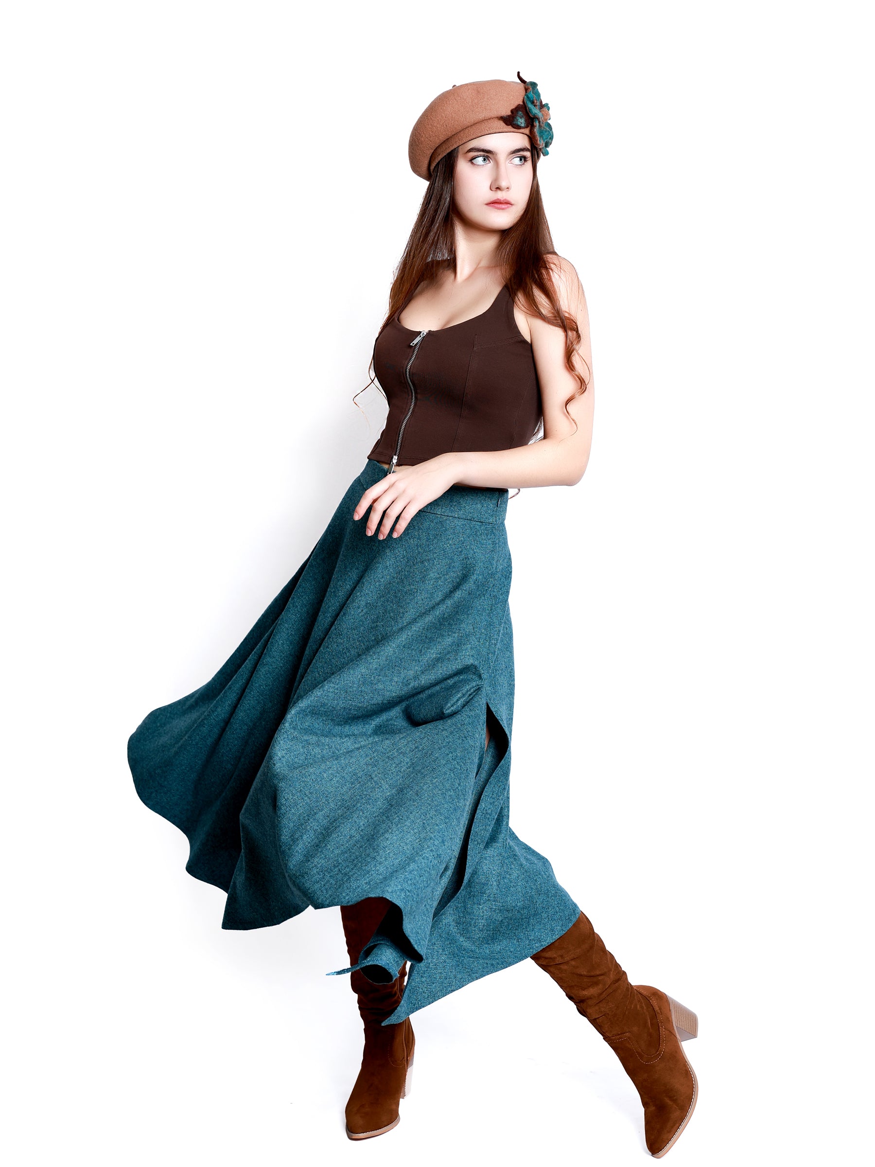 Full-length view of a model wearing a beige wool beret hat as a statement accessory.