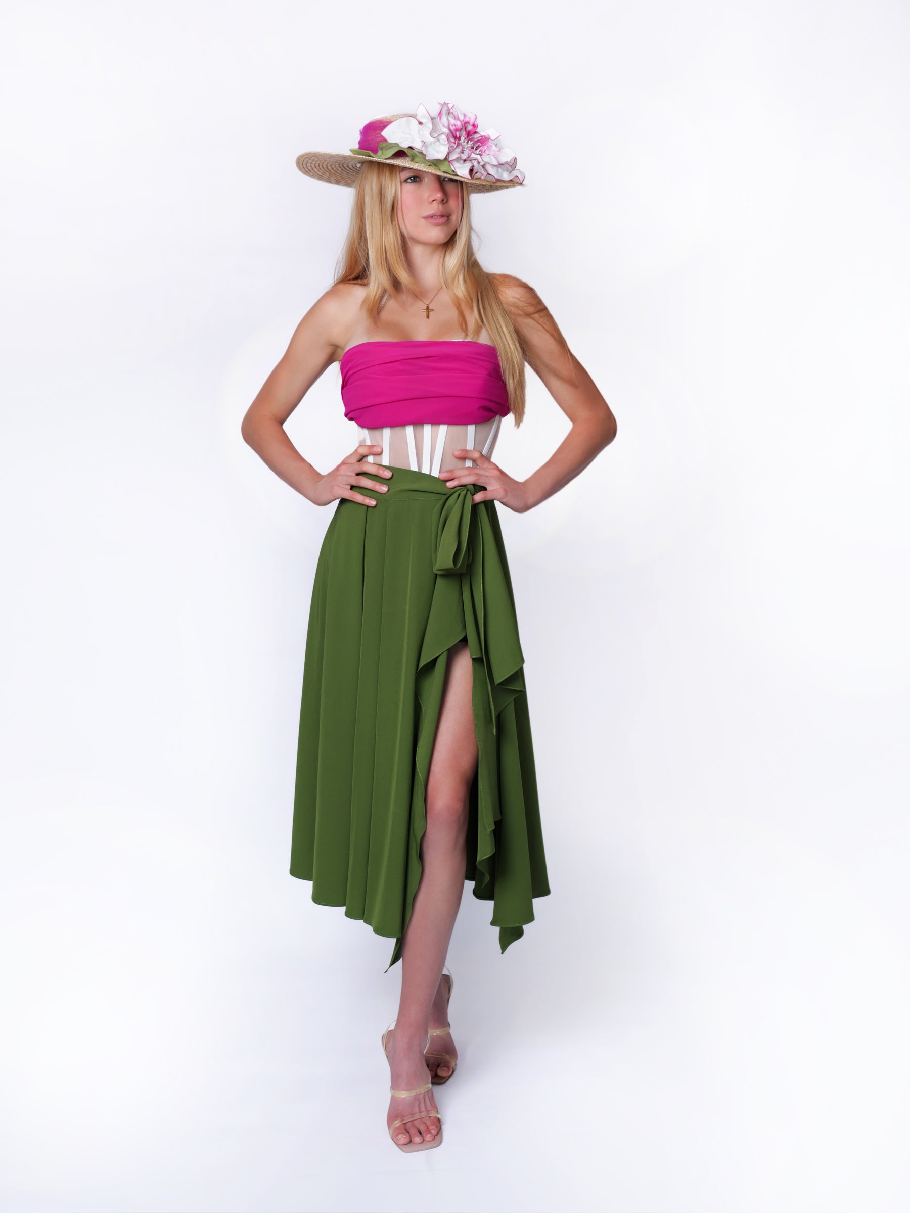 Full-length view of a model wearing a straw summer sun hat as a statement accessory.