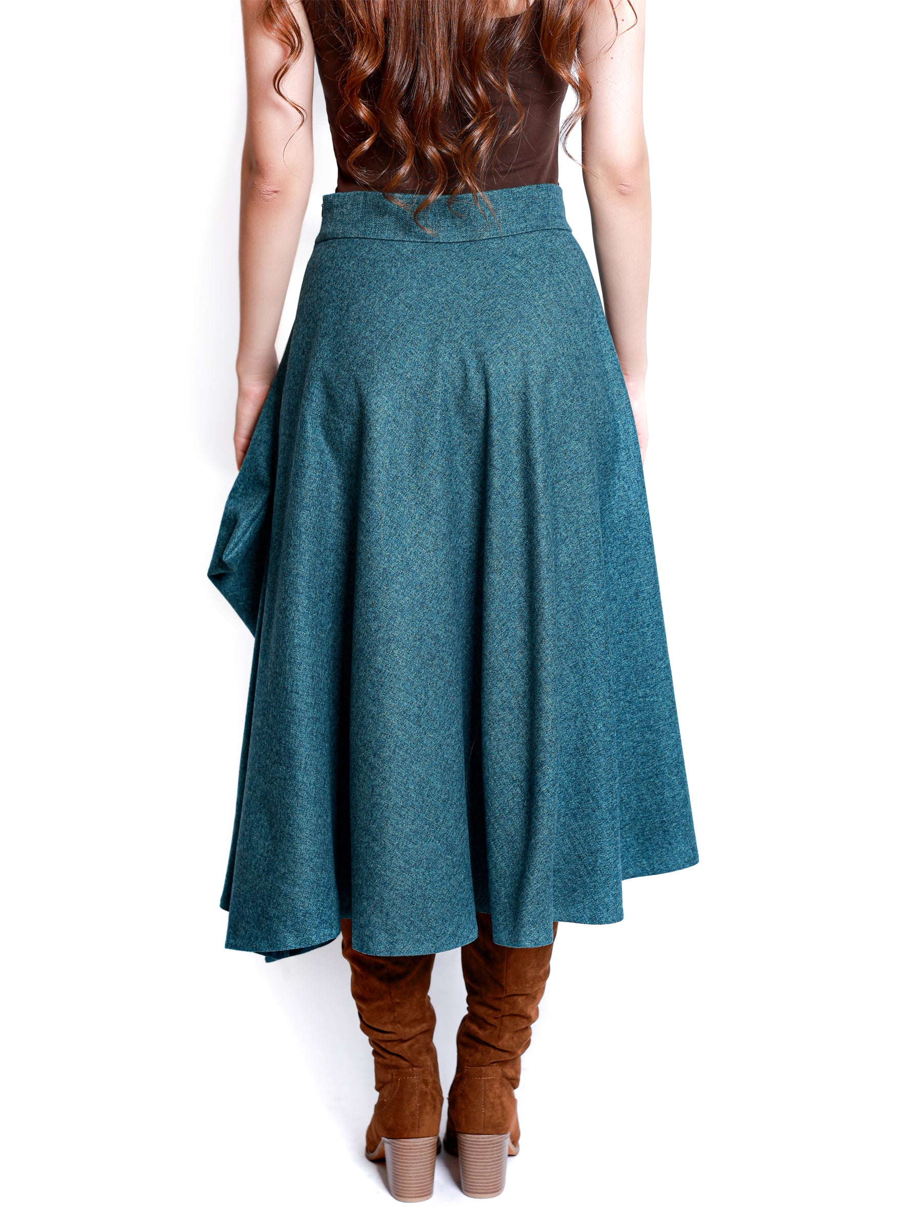 Back view of a teal blue midi skirt shown from waist to hem, highlighting the flowing cut.